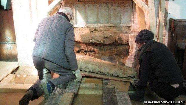 The tomb being removed