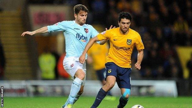 Oxford's Danny Rose and Exeter's Arron Davies