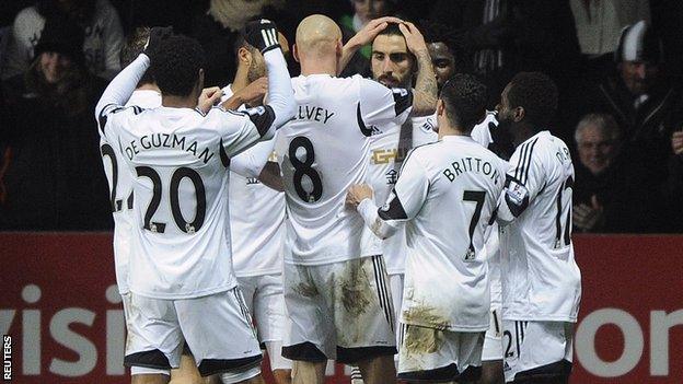 Swansea City celebrate Chico's second goal against Fulham