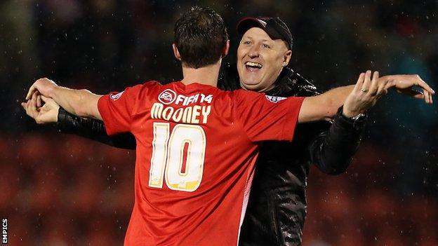 Leyton Orient manager Russell Slade embraces David Mooney