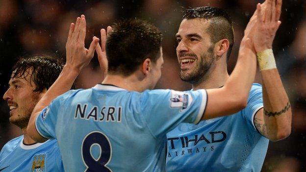 Alvaro Negredo celebrates with Sami Nasri