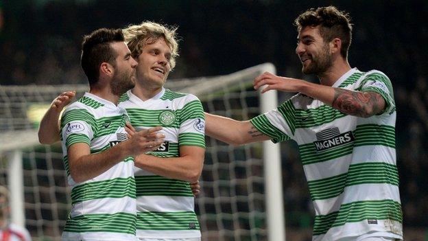 Joe Ledley celebrates with Teemu Pukki and Charlie Mulgrew after opening the scoring.