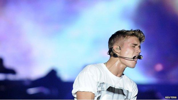 Canadian pop singer Justin Bieber performs during his "Believe" concert at the Olimpic Stadium in Santo Domingo in this October 22, 2013 file photo.