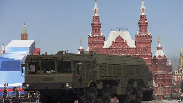 Russian Iskander missiles make their way through Red Square during a rehearsal for the Victory Day military parade in Moscow, Dec 2013