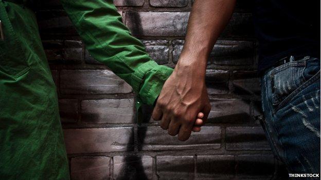 Couple holding hands