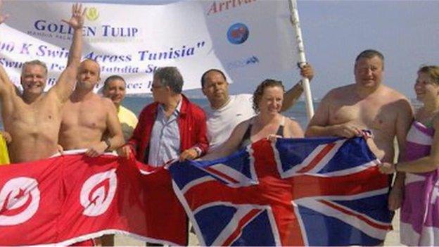 Stuart Hyde, second right, at the charity swimming event