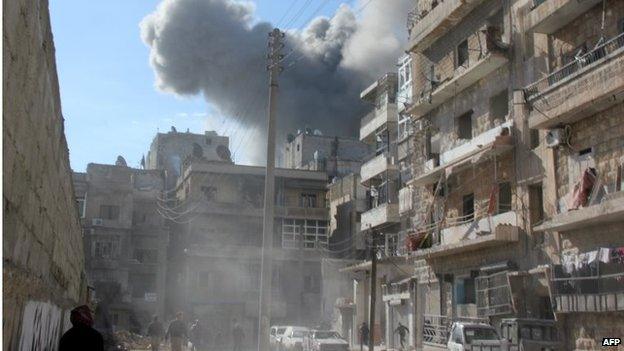 Smoke billows following an alleged air strike by Syrian government forces on January 31