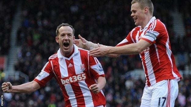 Charlie Adam celebrates after scoring Stoke's opening goal