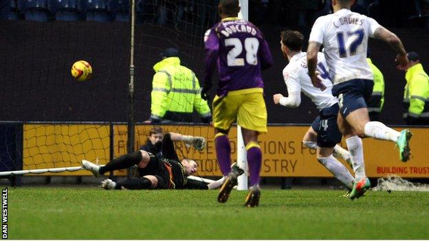 Joe Garner scores Preston's second goal from the penalty spot