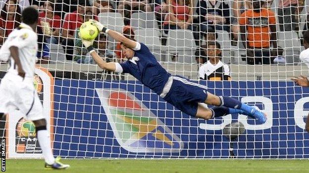 Libyas goalkeeper Nashnush saves during the African Nations Championship final