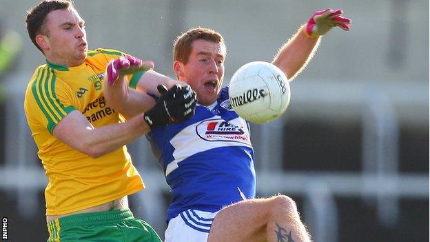 Martin McElhinney of Donegal competes for possession with Darren Strong of Laois