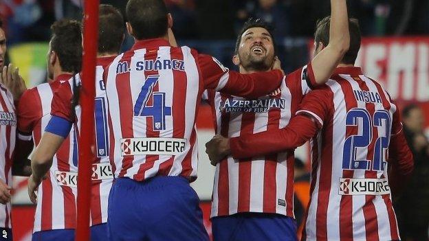 Atletico's David Villa, second left, celebrates his goal with team-mates