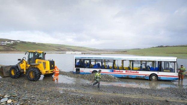 Stranded bus at Newgale, Pembrokeshire being recovered