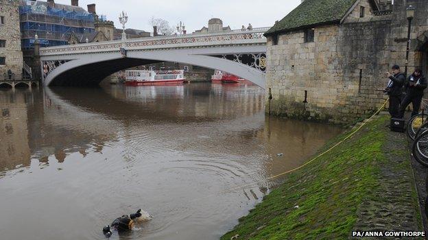 Police divers carry on their search of the River Ouse near Lendal.