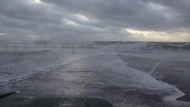 Waves crashing over Teignmouth seafront