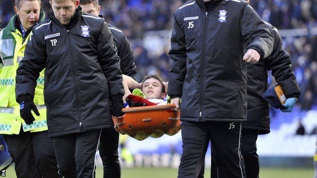 On-loan Birmingham City defender Tom Thorpe is stretchered off on his league debut at St Andrew's on Saturday