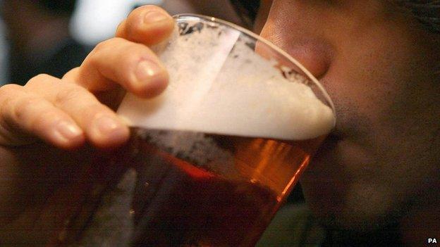 A man drinking a pint