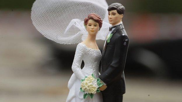 A model of a bride and groom