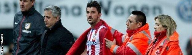 David Villa (centre) comes off injured v Real Sociedad