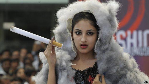 Indian students showcase designs related to cancer prevention for World Cancer day in Hyderabad on February 4, 2013