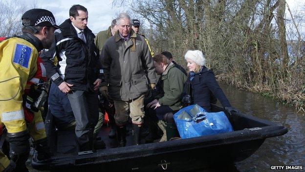 Prince Charles in boat visiting flood-hit areas of Somerset on 4 February 2014