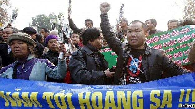 Protesters during a gathering to mark the 40th anniversary of the Chinese occupation of the disputed Paracel islands in the South China Sea, in Hanoi, Vietnam, 19 January 2014