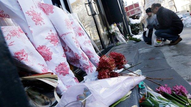 Flowers placed outside Philip Seymour Hoffman's apartment in New York on 4 February 2014