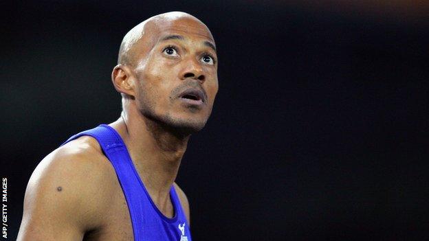 Frankie Fredericks of Namibia waiting for the results in the men's 200m semi-finals race one during the Olympic Games athletics competitions at the Olympic Stadium in Athens.