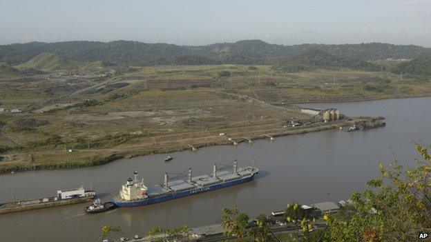 A ship leaves the Pedro Miguel locks on its route to Gatun lake in the Panama Canal near an area under construction as a part of its expansion project in Panama on 4 February, 2014