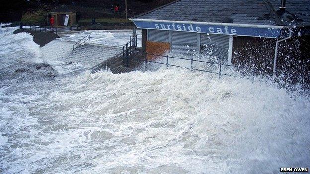 Waves lash into Surfside Cafe at Caswell Bay, Wales, January 4th 2014