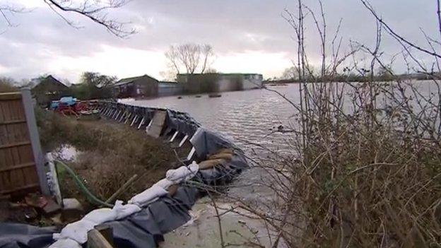 Barrier holding back flood water in Moorland