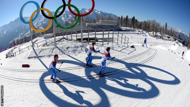 Officials ski the Olympic course in Sochi