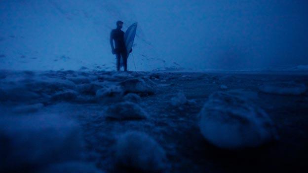 Surfer in a still from film North of the Sun