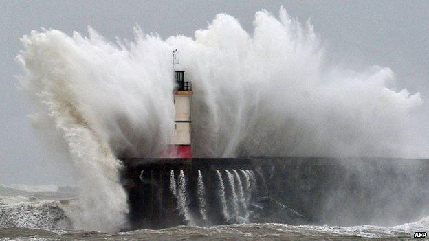 Newhaven Lighthouse is battered by waves during stormy weather on 5 February