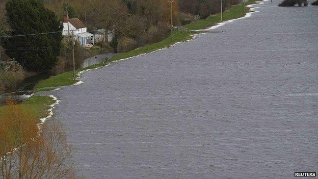 Floodwater is seen close to a house near Burrowbridge on the Somerset Levels