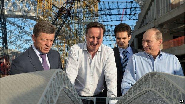 Russian President Vladimir Putin, right, and British Prime Minister David Cameron visit the Fisht Olympic Stadium on 10 May 2013.