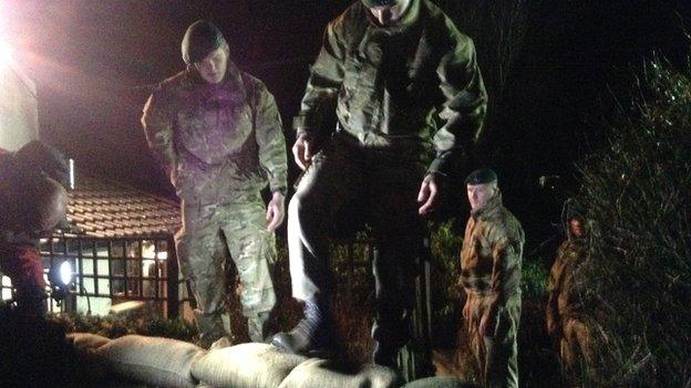 Royal Marines reinforce defences with sandbags in the Somerset Levels