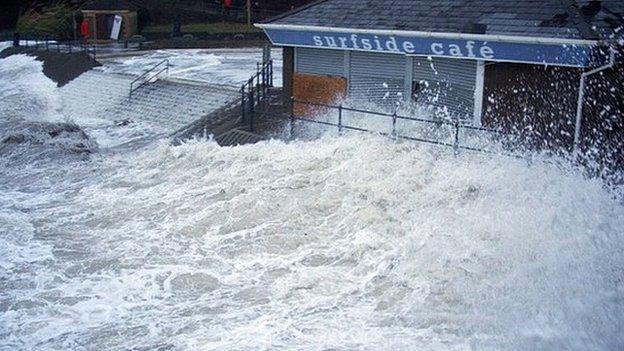 Waves lash into Surfside Cafe at Caswell Bay, Wales, January 4th 2014