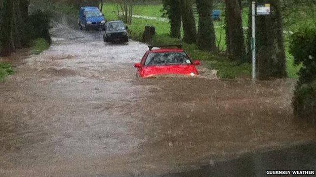 A car gets stuck in puddle