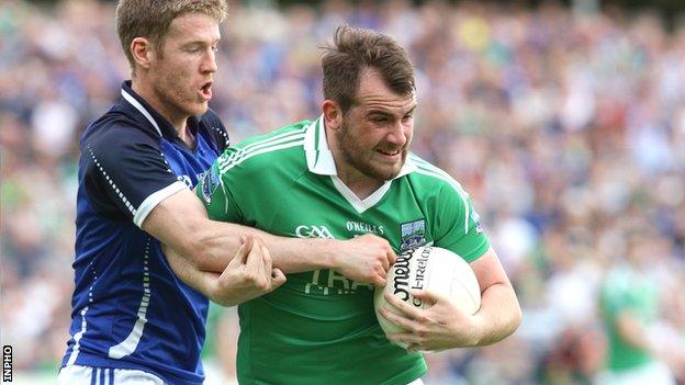 Cavan's Rory Dunne challenges Sean Quigley