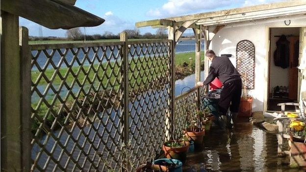 Ron Smith, who lives in Aller, keeps an eye on flood water levels