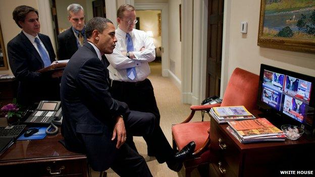 President Barack Obama listens with a group of advisers to a speech by former Egyptian leader Hosni Mubarak