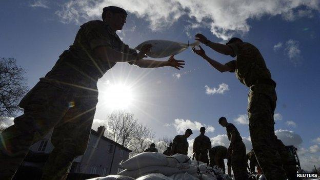 Royal Marines from 40 Commando lay sandbag water defences in the village of Moorland