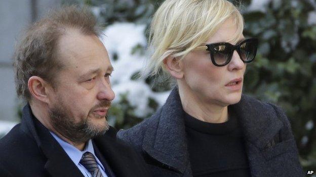 Filmmaker Andrew Upton, left, and his wife Cate Blanchett arrive for the funeral of actor Philip Seymour Hoffman at the Church of St. Ignatius Loyola 7 February 2014