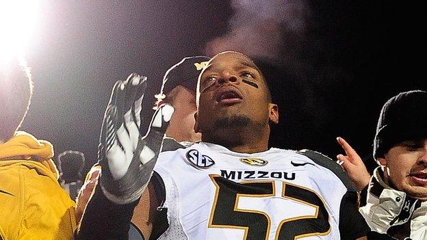 Missouri defensive lineman Michael Sam jumps into the stands at the end of a football game on November 23, 2013.