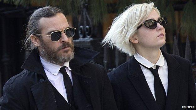 Actor Joaquin Phoenix (L) arrives for actor Philip Seymour Hoffman's funeral at the Church of St Ignatius Loyola in New York on 7 February 2014