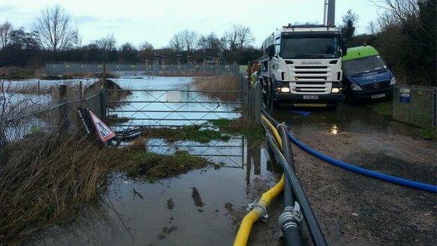 Floodwater threatening a substation near Reading