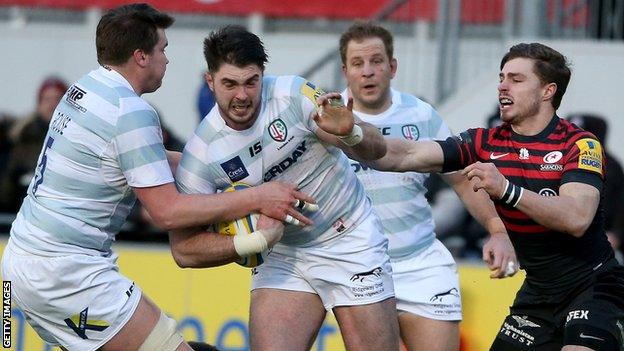 Eamonn Sheridan of London Irish takes on the Saracens defence