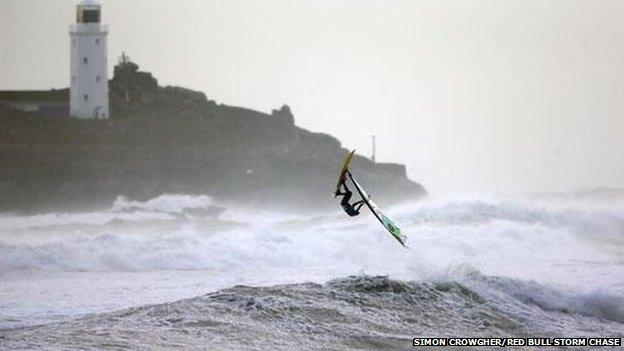 Professional windsurfer in Gwithian, in Cornwall,