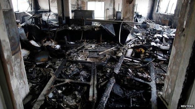 Burnt-out interior of a government building in Mostar on 8 February 2014